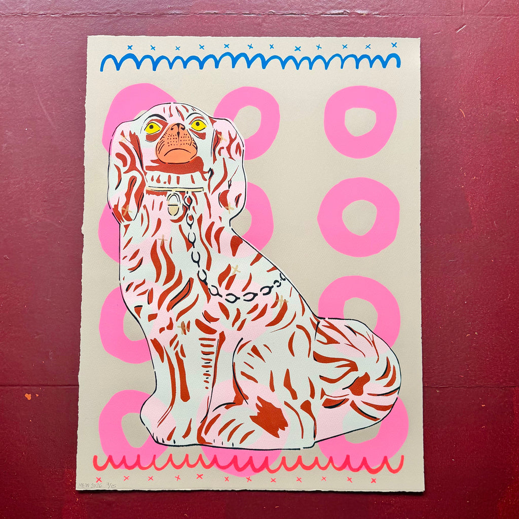 Screen print of a dog with a pink and blue border on a cream background with pink circles 