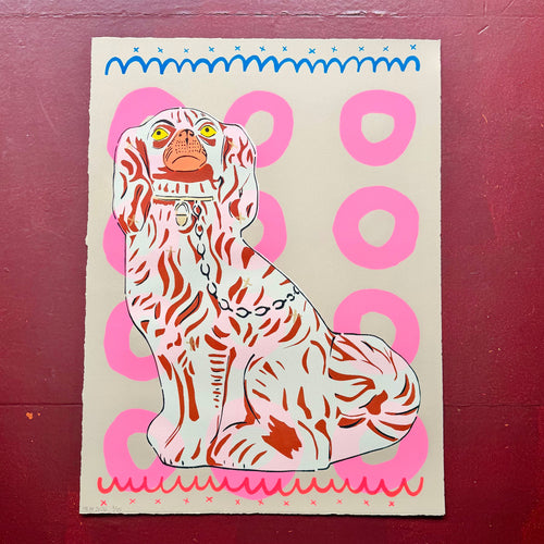 Screen print of a dog with a pink and blue border on a cream background with pink circles 